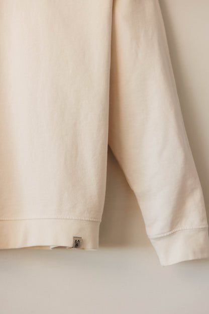 Beige sweatshirt on a light beige background