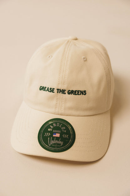 Beige cap with text and logo on a beige background