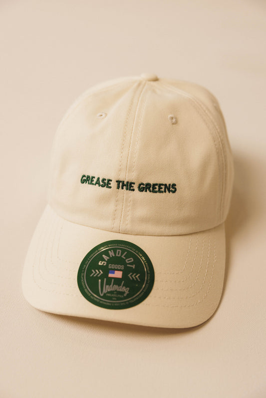 Beige cap with text and logo on a beige background