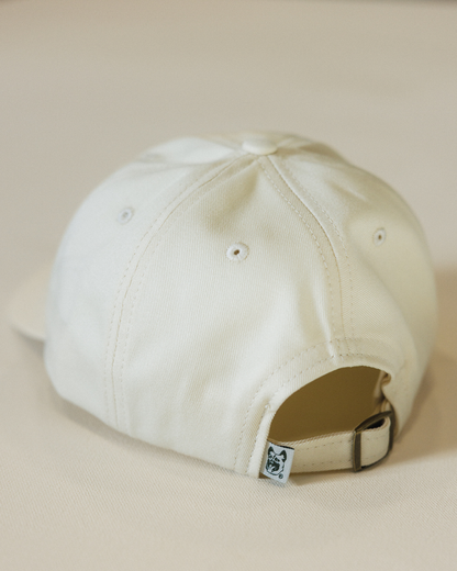 Beige baseball cap on a beige background