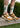 Ivory socks with green dog logo and brown sneakers